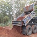 Throgs Neck, NY – Two Workers Injured During Collision Involving Dump Truck