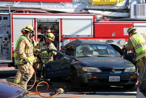 firefighters helping a car wreck