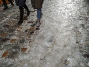 people walking on an icy road