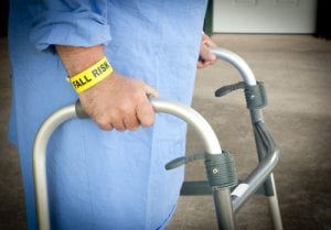 Elderly person using a walker in hospital