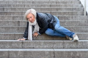 woman rolling down stairs