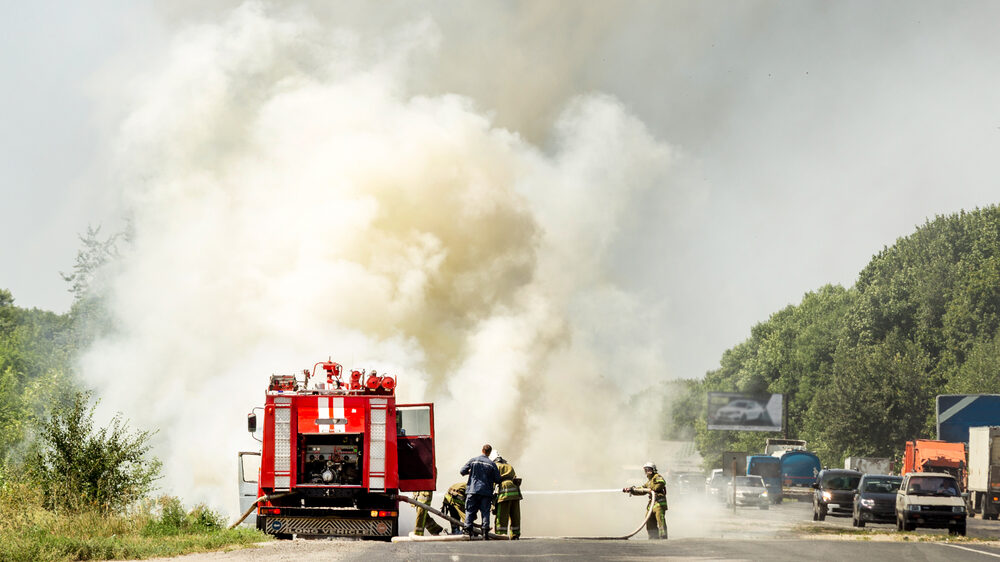 car fire with firemen