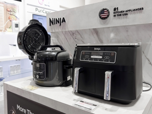 Ninja Foodi lawsuit image featuring Ninja kitchen appliances, including a pressure cooker and air fryer on display.